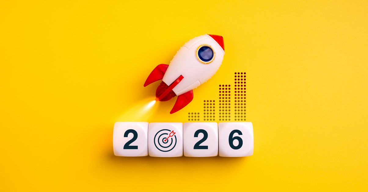 Rocket launching above 2026 cubes with target icon and growth graph on yellow background, symbolizing business startup, creative market, innovation strategy, new year goals, and future success.