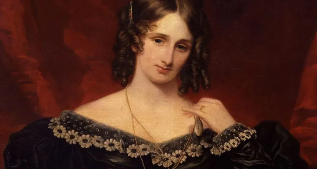 Retrato de Mary Shelley, escritora inglesa autora de Frankenstein. A pintura de Samuel John Stump mostra ela sentada, com cabelos escuros cacheados, vestido preto adornado com flores claras e um colar longo, diante de um fundo vermelho escuro. Seu olhar é sereno e levemente melancólico.